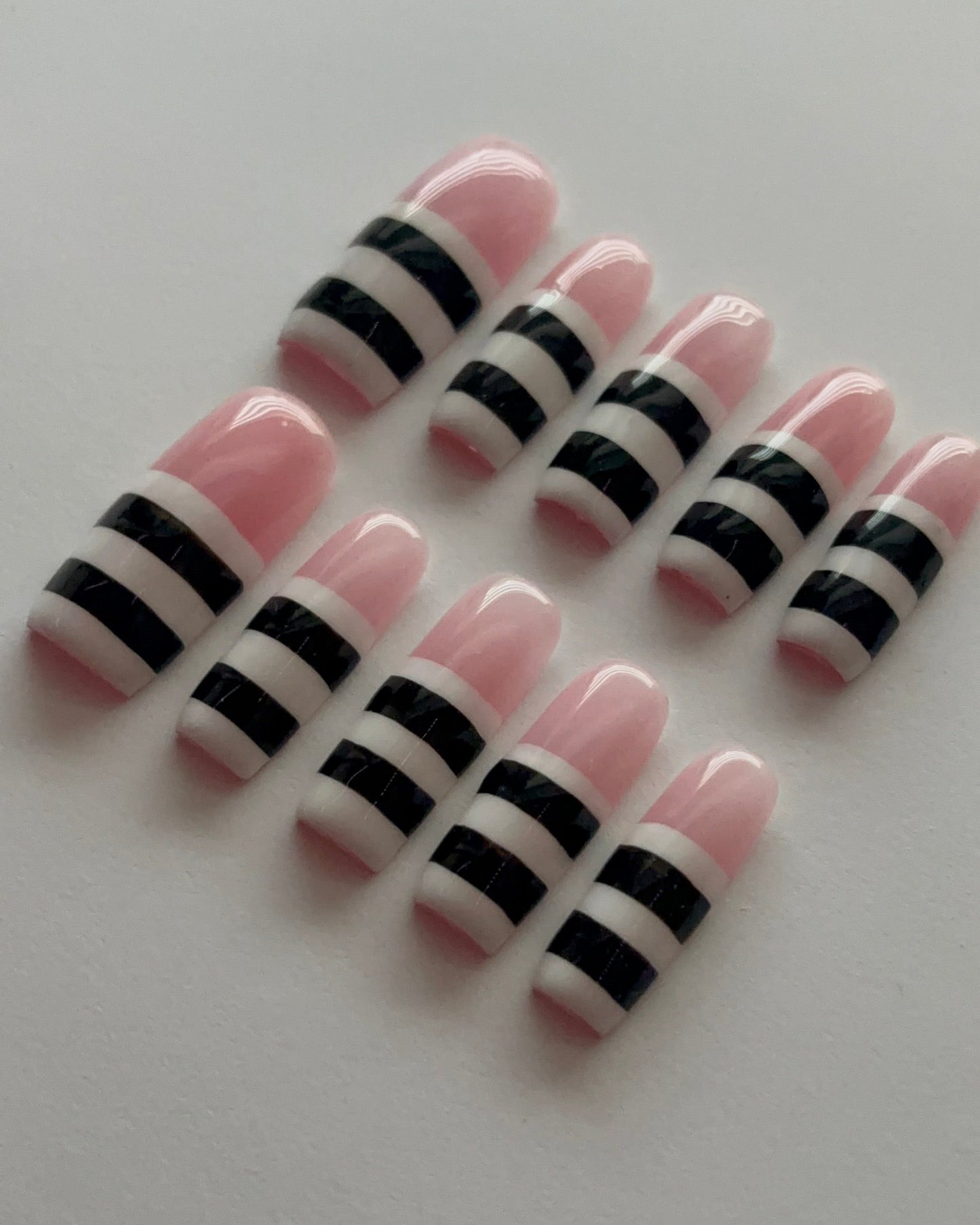Striped Down press-on nails - angle view
